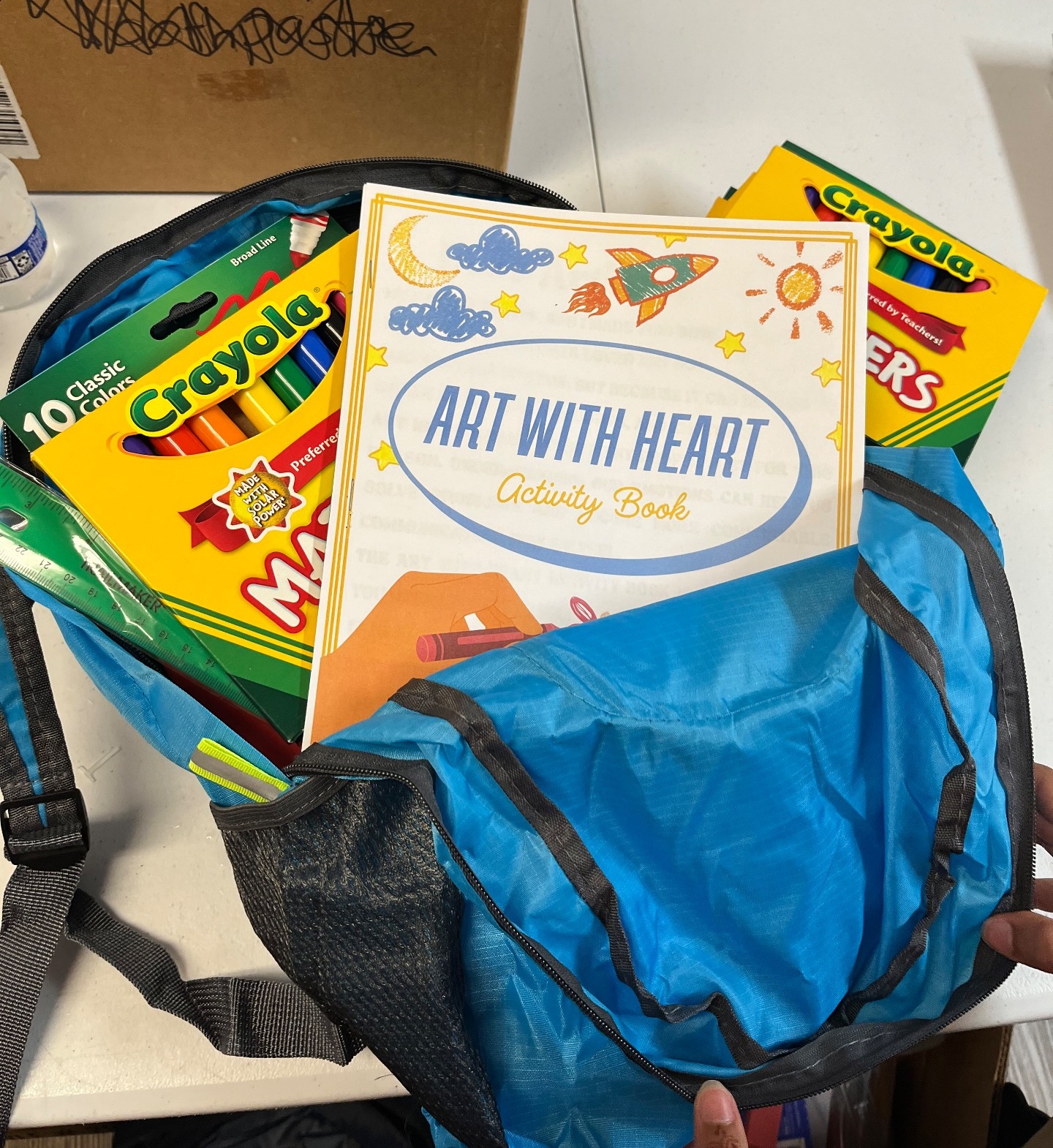 Safiya with Art With Heart activity books